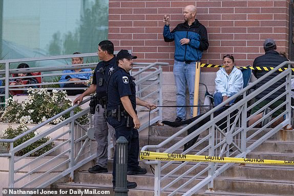 At 6.A.M. Idaho State Police with dogs do a sweep of trash cans, news media equipment and the cloud outside the Ada County Courthouse ahead of the July, 23rd, 2025 sentencing of killer Bryan Kohberger.