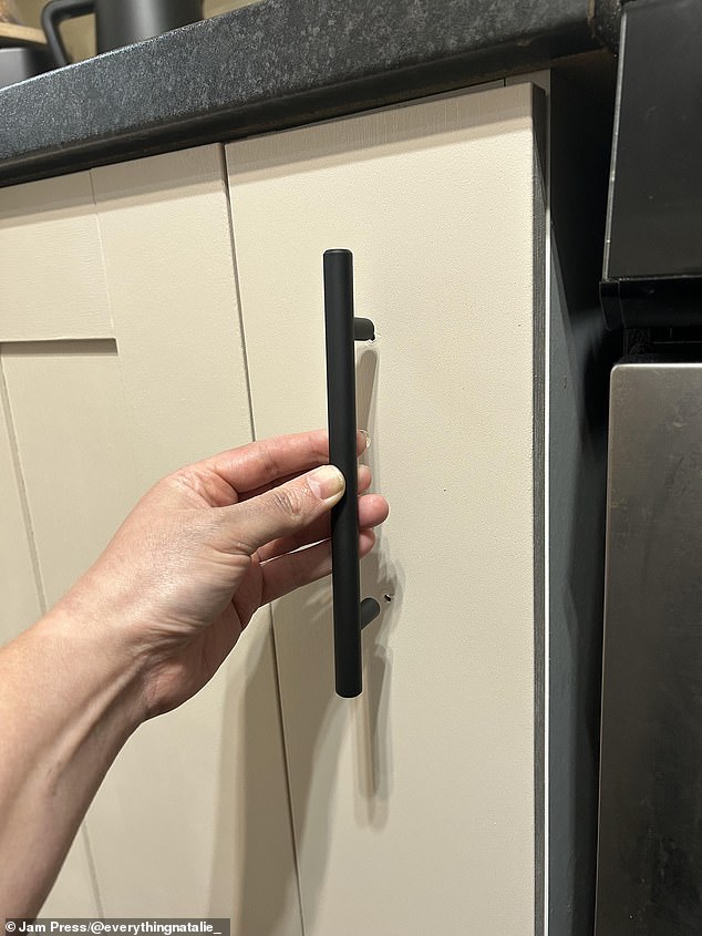 She wanted to replace the old handles but instead of forking out a fortune on new ones, she gave them a light sand, sprayed them with Rust-Oleum black matte spray paint and then sealed with a matte sealant spray to create a modern look