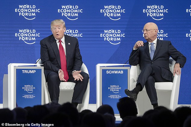 US President Donald Trump, left, speaks with Klaus Schwab, chairman of the World Economic Forum (WEF)
