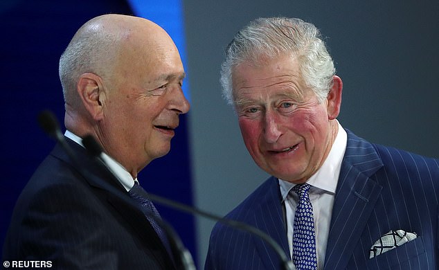 Klaus Schwab is pictured speaking with Britain's King Charles