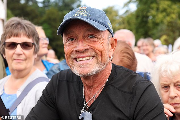 Phil Smith, a royal super-fan, reacts, on the day Britain's King Charles and Queen Camilla visit the Sandringham Flower Show, at Sandringham House, Norfolk