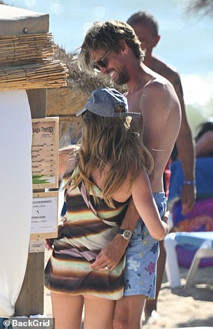 The couple have jetted off to the Algarve for some sun with their four children - Sophia, 14, Liberty, 10, Johnny, seven, and Jack, six