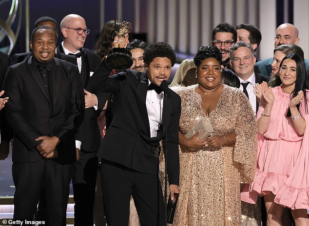 A glimmer of hope came for Colbert in 2023 when Oliver's show was moved to another category, but The Daily Show with Trevor Noah took home the win (Pictured: Trevor Noah and the crew accepting the Emmy in 2024)