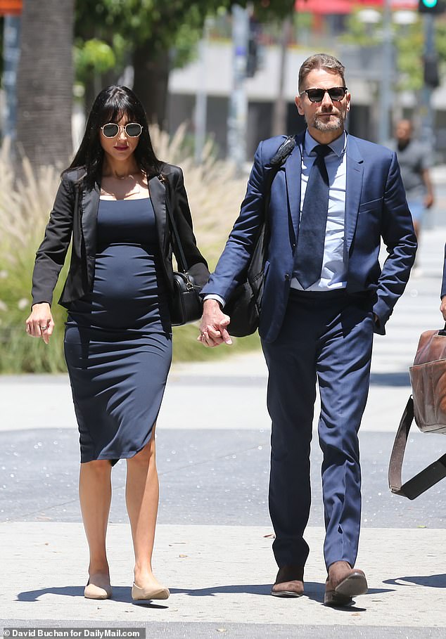Wallace's baby bump was on full display as she and Gruffudd arrived at court on Wednesday