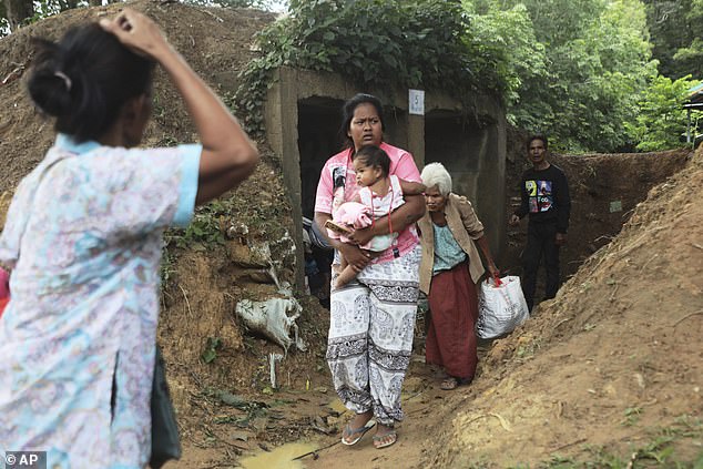 Thai people who fled clashes between Thai and Cambodian soldiers take shelter in Surin province, northeastern Thailand, Thursday, July 24, 2025