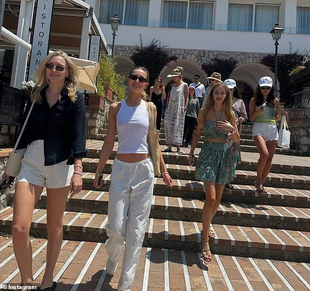 One image from the hen do shows the group of friends walking down the steps of a local ristorante, dressed in relaxed resortwear