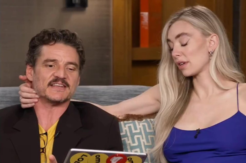 Vanessa Kirby touching Pedro Pascal's face during an interview.