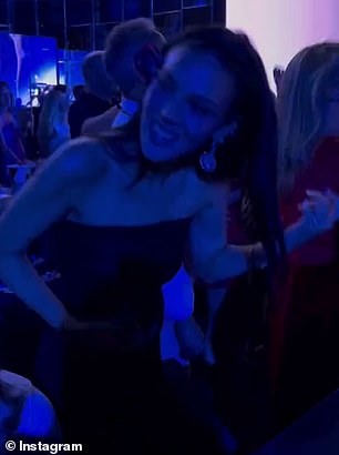 The stunner showcased her dance moves and played air guitar