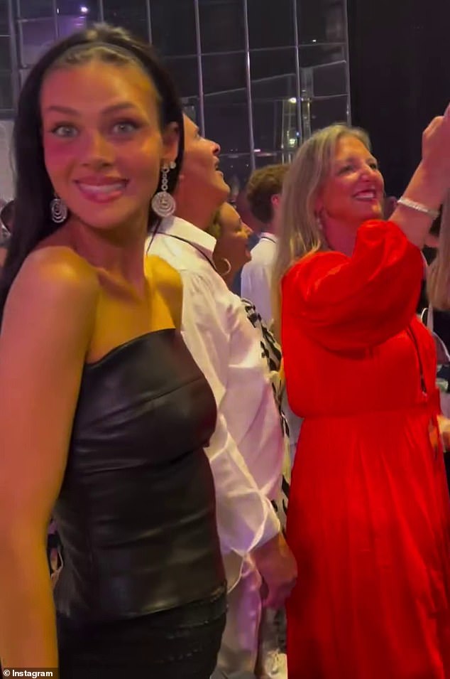 Nicola (L) stunned in a black leather mini dress as she strutted her stuff on the dance floor before enjoying a lavish fireworks display