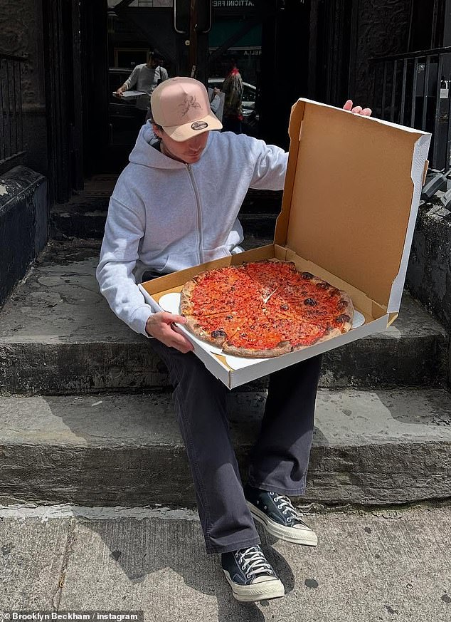 Brooklyn later confirmed the lavish holiday was over as he shared a snap of himself enjoying a huge pizza as the couple arrived in NYC