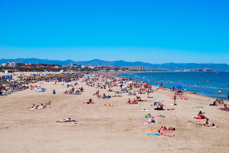 Crowded beach in Valencia, Spain.