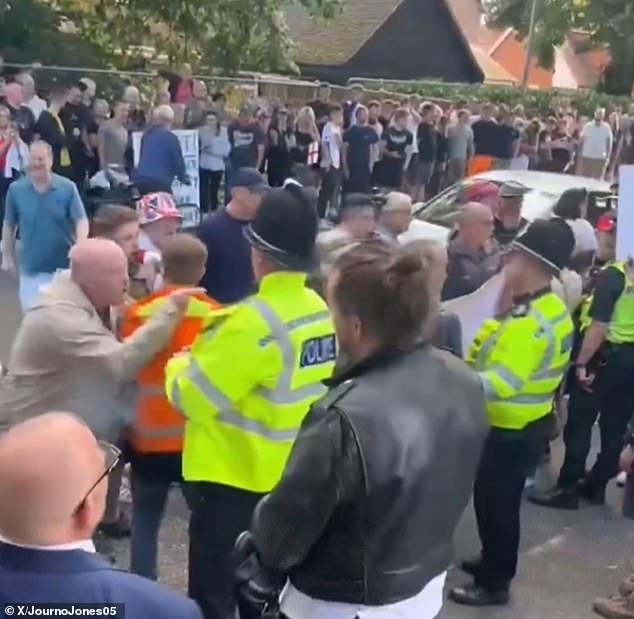 An agitated protester could be seen clashing with counter-protesters and police in Diss