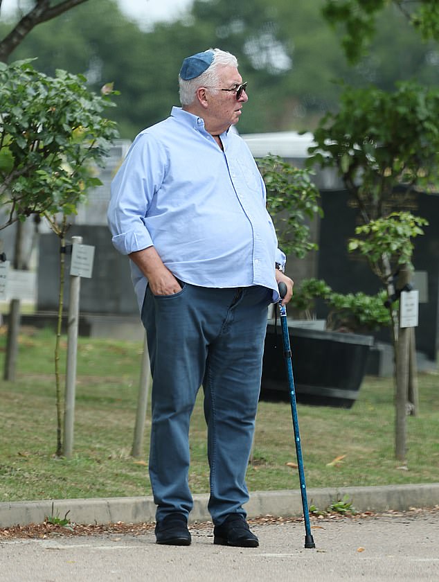 Mitch, who was wearing a blue kippah, opted for a smart pale blue shirt and jeans