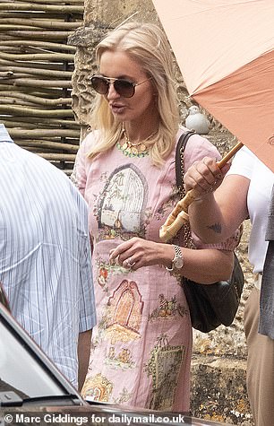 A stylish guest departs the wedding rehearsal