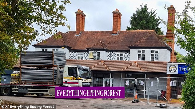 Metal fencing is delivered to the migrant hotel in Epping today as it tries to bolster defences