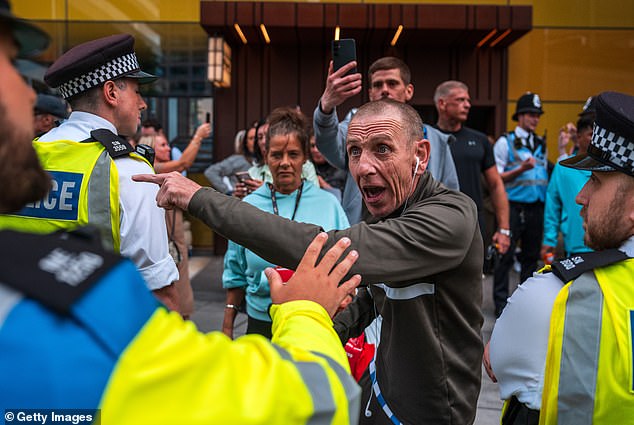 Protests outside the Britannia International Hotel in Canary Wharf in London last night