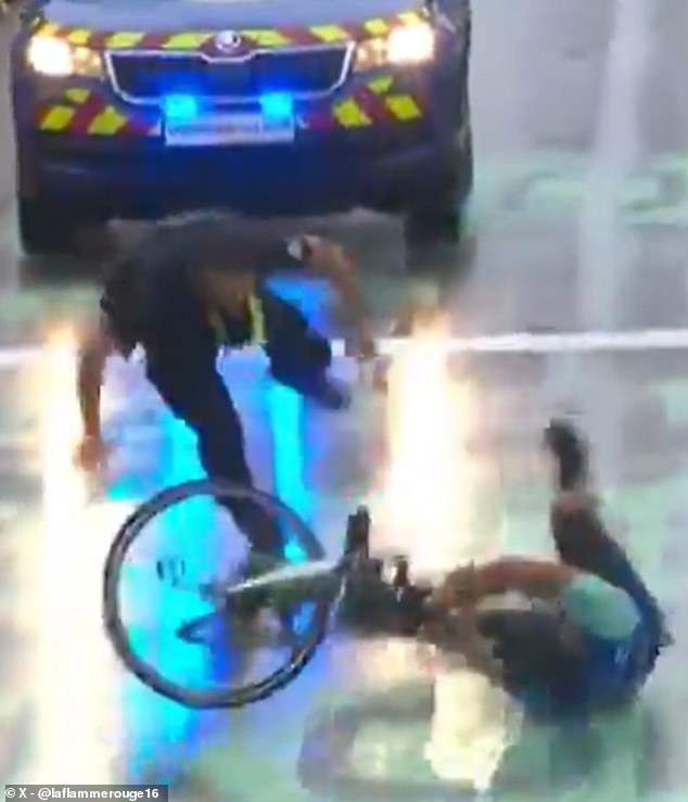 The prankster attempted to cross the finish line at the end of stage 17 on Wednesday, before a member of the security team tackled him to the concrete