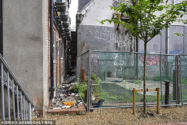 Wasteground near car park on isolated street where complainant says he was raped and necklace stolen