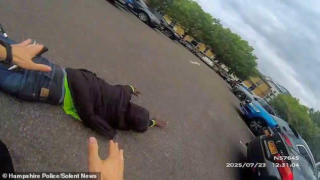 While he initially manages to get on his bike, he eventually falls off, with officers quickly tackling him to the ground in a car park as he desperately tries to escape their grip