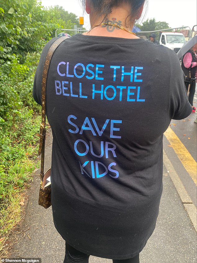 One of the Epping protestors wears a t-shirt that reads 'Close The Bell Hotel, Save Our Kids'