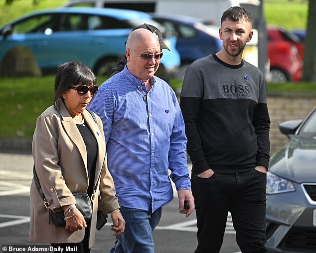 Jay's brother Zak Slater (right) arrives at Preston Coroner's Court for the inquest today