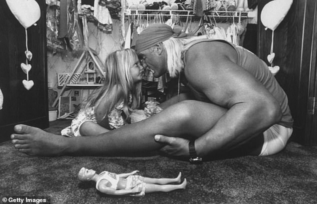 The wrestler is captured affectionately rubbing noses with his 3-year-old daughter, Brooke