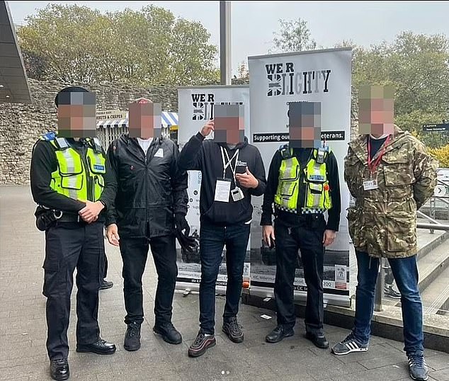 Fundraisers pictured posing with police officers last year