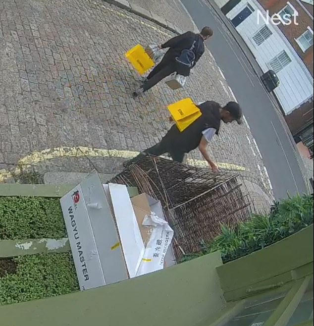 One of the men makes off with two cases of bottled water, before the first thief steals two more for himself