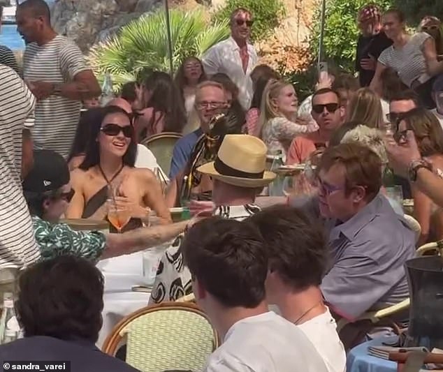 Amid their trip the couple enjoyed a swanky lunch with Brooklyn's godfather Elton John, who sources revealed planned the dinner in a desperate attempt to calm the family's feud