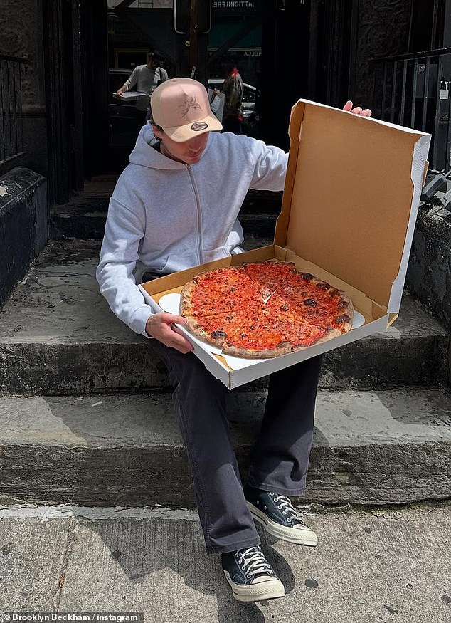 Brooklyn later confirmed the lavish holiday was over as he shared a snap of himself enjoying a huge pizza as the couple arrived in NYC