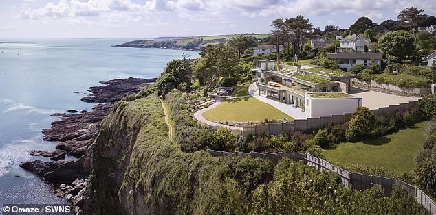 The immense waterfront Cornish Omaze house with a swimming pool, hot tub and terrace