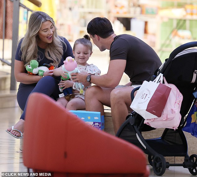 The family were all smiling as the parents sat down to play with a variety of toys with little Lucia