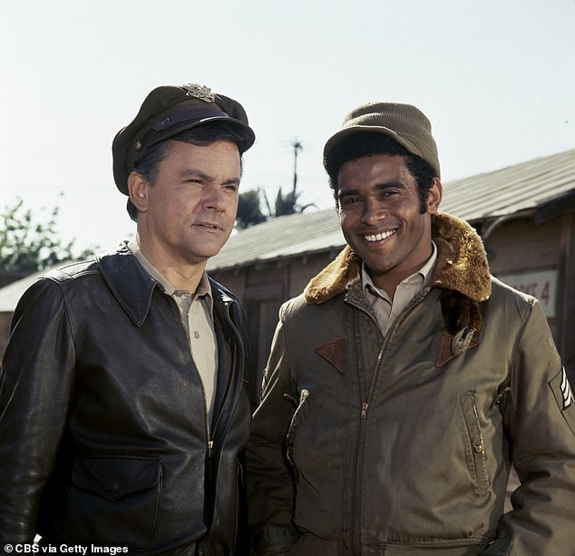 The performer held the sad distinction of being the last living cast member from Hogan's Heroes, the classic CBS sitcom set in a POW camp in Nazi Germany; pictured (R) with star Bob Crane (L) on Hogan's Heroes