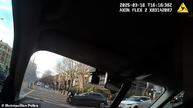 The moment an e-bike thief gets instant karma after crashing into the side of a car at a junction while trying to escape police