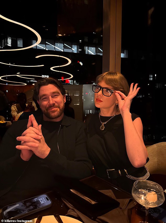 Eagle-eyed fans also noted that Travis' phone background is a photo of him with Taylor