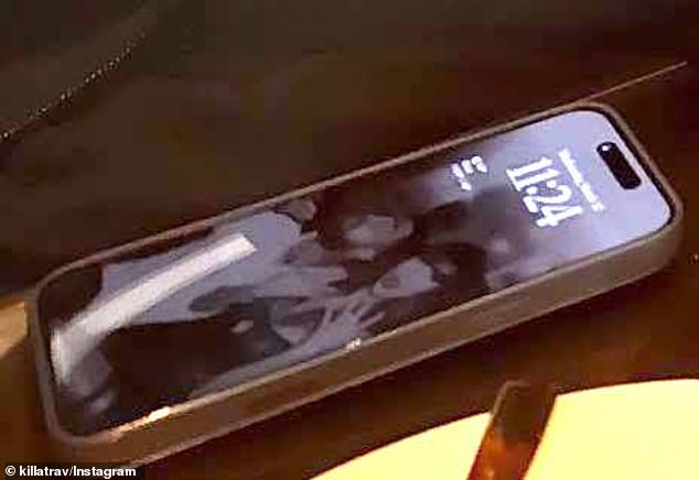 Taylor appeared to flaunt her ring finger in the grainy snap as fans speculated over whether Travis has popped the question