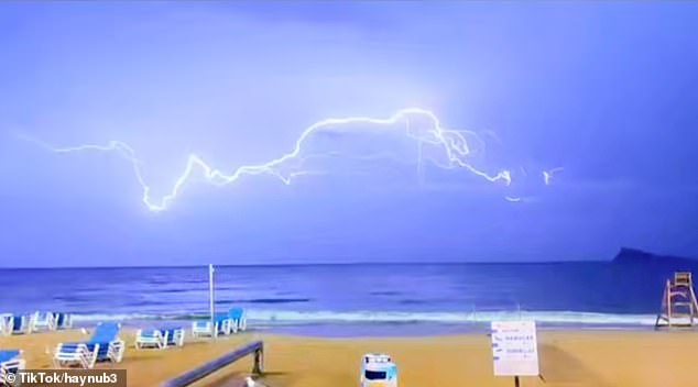 British tourists in Benidorm have been forced to take shelter as enormous thunder storms lash down