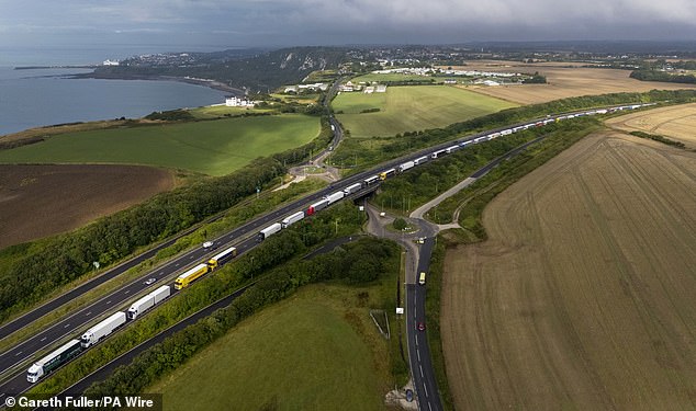 Lorries queue along the A20 outside Dover in Kent as the Port of Dover remains busy today