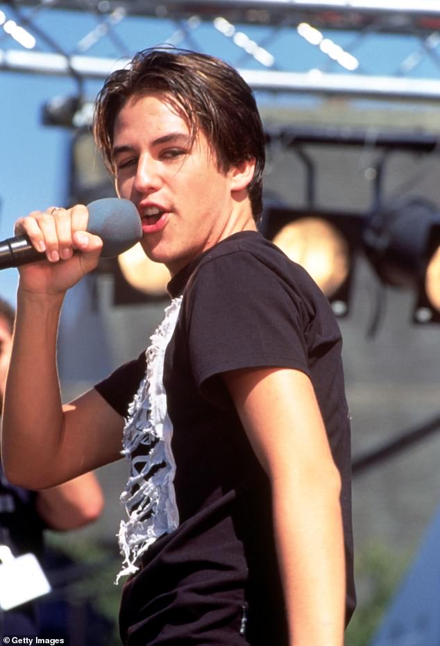 Kavana opens up on leaving a bevvy of 'beautiful girls' who were waiting for him in a lobby miffed because he 'couldn't have sex with them' amid his secret battle to keep his true sexuality under wraps [pictured in 1997]