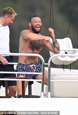 Conor showed off his muscular and tattooed frame as he went shirtless in a pair of blue swimming trunks, before stripping down to his boxer.
