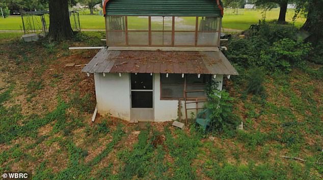 The gang of adults have been accused of abusing victims, aged three to 15, with shock collars to the genitals and rape inside a grimy, nightmarish storm bunker (pictured) in Brent