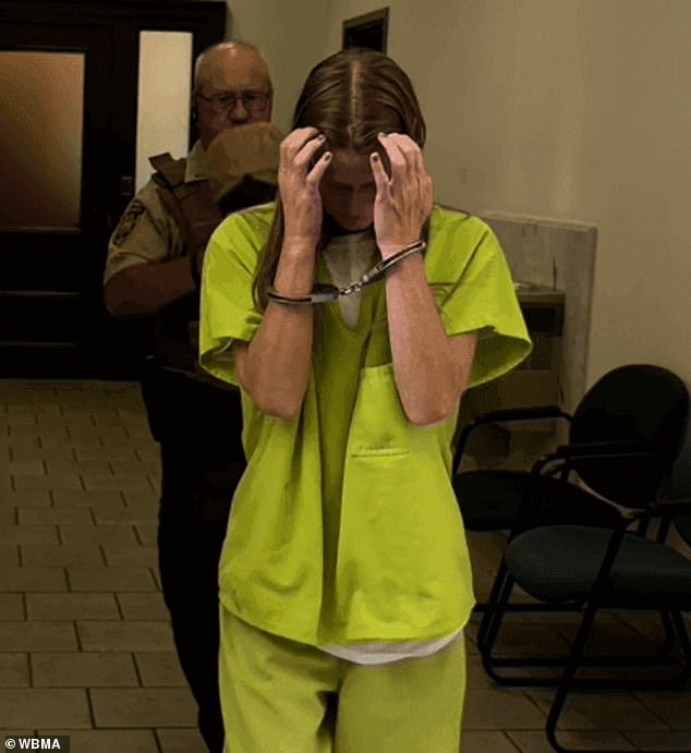 Along with Brewer, Sara (pictured) was seen trying to shield her face before all three of them decided to remain in custody following their bond hearing