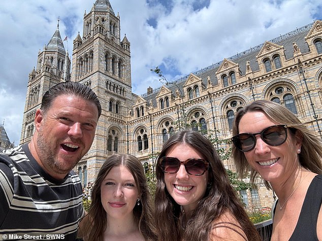The Danny Dyer lookalike competition winner, Mike Street, is pictured with his family in London