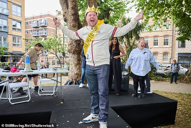 Mike was jubilant in celebration after being crowned the 'Best Danny', and was pictured punching the air in front of the crowds who turned up for the occasion