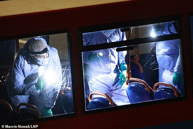 Forensic officers gather evidence on the bus following the stabbing in Woolwich in January