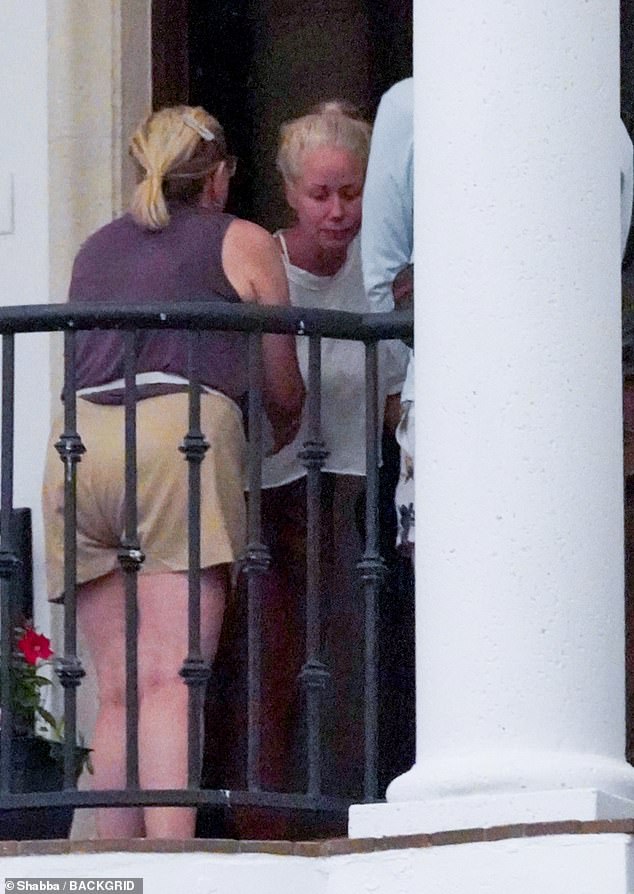 The 29-year-old widow appeared grief stricken with her tear streaked, swollen face and usually straight, blonde hair thrown up into a messy bun the day before as her loved ones arrived to comfort her