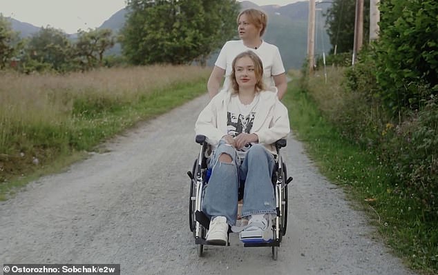 Maria pictured in Norway with her mother, now in a wheelchair after her spine was broken