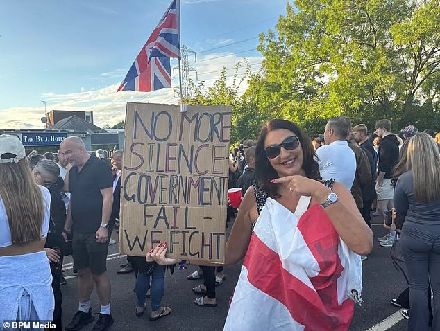 Another woman had a Union Jack attached to her sign which read: 'No more silence'