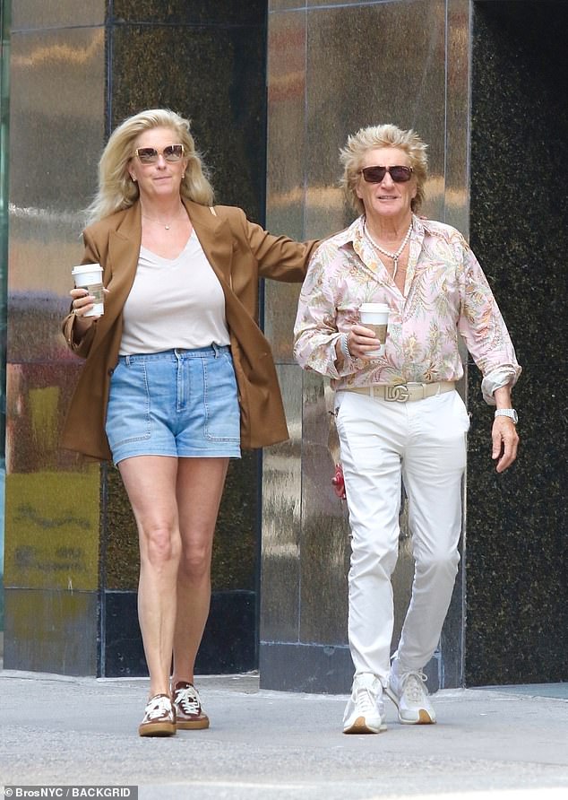 They both appeared in high spirits as Penny put her arm around her partner, with each of them holding a coffee in their hand