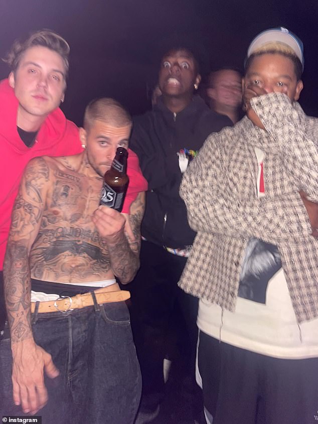 Hailey joined Justin at his album listening party, where he showcased his tattooed arms while shirtless and enjoying a beer